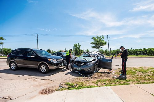 MIKAELA MACKENZIE / WINNIPEG FREE PRESS

Police respond to a multiple vehicle collision on Portage Avenue at Saint Charles Street in Winnipeg on Friday, July 3, 2020. 
Winnipeg Free Press 2020.