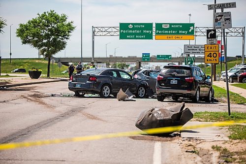 MIKAELA MACKENZIE / WINNIPEG FREE PRESS

Police respond to a multiple vehicle collision on Portage Avenue at Saint Charles Street in Winnipeg on Friday, July 3, 2020. 
Winnipeg Free Press 2020.