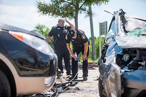 MIKAELA MACKENZIE / WINNIPEG FREE PRESS

Police respond to a multiple vehicle collision on Portage Avenue at Saint Charles Street in Winnipeg on Friday, July 3, 2020. 
Winnipeg Free Press 2020.