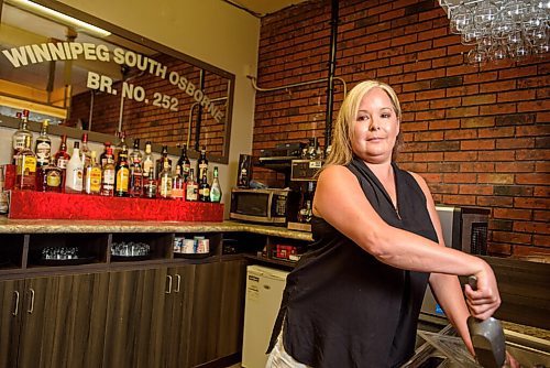 JESSE BOILY  / WINNIPEG FREE PRESS
Naomi Vermette, the manager at the Winnipeg South Osbourne Legion, stops for a photo at her bar on Friday. Many legions are struggling to survive due to the pandemic.  Friday, July 3, 2020.
Reporter: Temur Durrani