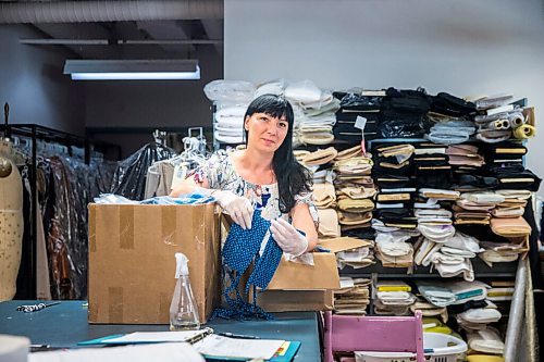 MIKAELA MACKENZIE / WINNIPEG FREE PRESS

Alena Zharska, head of wardrobe, poses with some of the masks ready to be delivered on Monday, July 6, 2020. The RWB wardrobe department has been working for nearly two months, putting their skills to use creating high-quality face masks to give to The Winnipeg Boldness Project.
Winnipeg Free Press 2020.