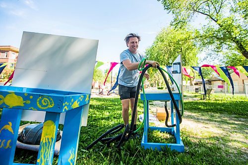 MIKAELA MACKENZIE / WINNIPEG FREE PRESS

Toby Gillies, studio programs manager, sets up outdoor hand washing stations on the first day of Art City Outside, a free drop-in  summer art program, in West Broadway in Winnipeg Monday, July 6, 2020. Standup.
Winnipeg Free Press 2020.