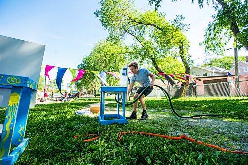 MIKAELA MACKENZIE / WINNIPEG FREE PRESS

Toby Gillies, studio programs manager, sets up outdoor hand washing stations on the first day of Art City Outside, a free drop-in  summer art program, in West Broadway in Winnipeg Monday, July 6, 2020. Standup.
Winnipeg Free Press 2020.