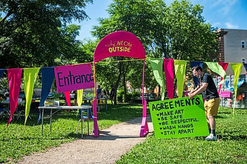 MIKAELA MACKENZIE / WINNIPEG FREE PRESS

Eddie Ayoub, artistic director, sets up the entrance (where participants are screened for health and safety before entering the area) on the first day of Art City Outside, a free drop-in  summer art program, in West Broadway in Winnipeg Monday, July 6, 2020. Standup.
Winnipeg Free Press 2020.