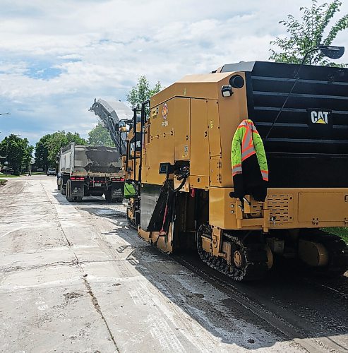 Canstar Community News These hulking pieces of equipment are sure signs of Winnipeg's second season -- road construction.