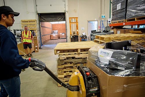 JESSE BOILY  / WINNIPEG FREE PRESS
Pallets full of computers are loaded into a truck that will be shipped out to rural Manitoba communities, so that refugees, as well as rural and Northern Manitoba families will be able to connect, at Computers For Schools on Monday. Monday, July 6, 2020.
Reporter:
