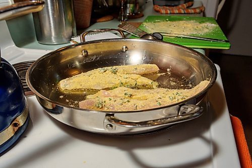 JESSE BOILY  / WINNIPEG FREE PRESS
Alison Gillmor prepares her pickerel dinner kit from Fusion Grill on Wednesday. Wednesday, July 1, 2020.
Reporter:Alison Gillmor