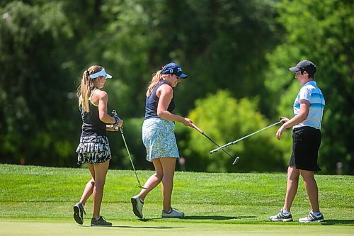 MIKAELA MACKENZIE / WINNIPEG FREE PRESS

Bobbi Uhl (left), Veronica Vetesnik, and Marissa Naylor tap clubs at the end of a game in the Manitoba Womens Amateur Championship at Bel Acres in Winnipeg Tuesday, July 7, 2020. For Mike Sawatzky story.
Winnipeg Free Press 2020.