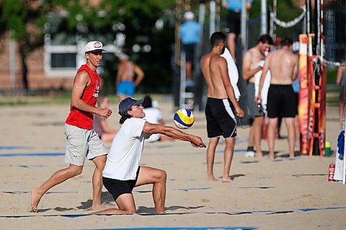 JOHN WOODS / WINNIPEG FREE PRESS
Former Manitoba Bison Dustin Spiring (red) and his teammate Zack Jansen (white) play beach volleyball on opening day of the adult league at Cindy Klassen Rec Centre in Winnipeg, Tuesday, July 7, 2020.

Reporter: Allen