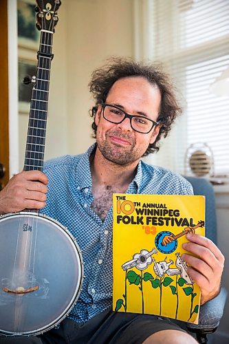 MIKAELA MACKENZIE / WINNIPEG FREE PRESS

Leonard Podolak, son of Folk Fest founder Mitch Podolak, poses for a portrait with a 1983 program in his house in Winnipeg on Wednesday, July 8, 2020. For Al Small story.
Winnipeg Free Press 2020.