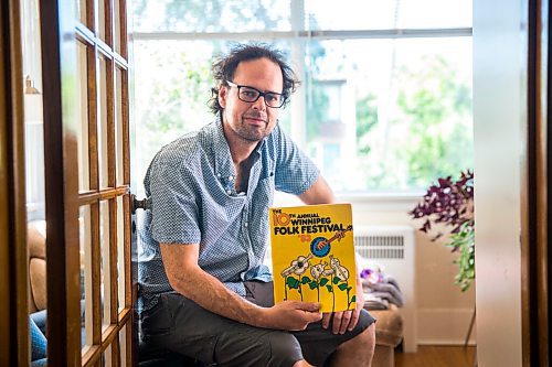 MIKAELA MACKENZIE / WINNIPEG FREE PRESS

Leonard Podolak, son of Folk Fest founder Mitch Podolak, poses for a portrait with a 1983 program in his house in Winnipeg on Wednesday, July 8, 2020. For Al Small story.
Winnipeg Free Press 2020.