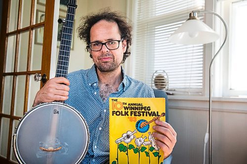 MIKAELA MACKENZIE / WINNIPEG FREE PRESS

Leonard Podolak, son of Folk Fest founder Mitch Podolak, poses for a portrait with a 1983 program in his house in Winnipeg on Wednesday, July 8, 2020. For Al Small story.
Winnipeg Free Press 2020.