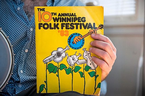 MIKAELA MACKENZIE / WINNIPEG FREE PRESS

Leonard Podolak, son of Folk Fest founder Mitch Podolak, poses for a portrait with a 1983 program in his house in Winnipeg on Wednesday, July 8, 2020. For Al Small story.
Winnipeg Free Press 2020.