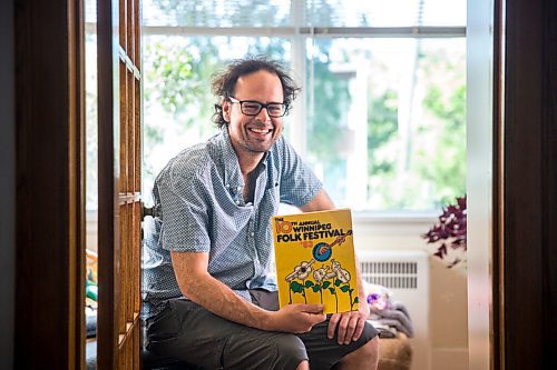 MIKAELA MACKENZIE / WINNIPEG FREE PRESS

Leonard Podolak, son of Folk Fest founder Mitch Podolak, poses for a portrait with a 1983 program in his house in Winnipeg on Wednesday, July 8, 2020. For Al Small story.
Winnipeg Free Press 2020.