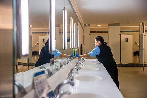 MIKAELA MACKENZIE / WINNIPEG FREE PRESS

Cynthia Cleodora wipes down high-touch areas in the washroom at the Winnipeg James Armstrong Richardson International Airport in Winnipeg on Wednesday, July 8, 2020. For Ben Waldman story.
Winnipeg Free Press 2020.