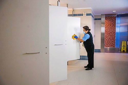 MIKAELA MACKENZIE / WINNIPEG FREE PRESS

Cynthia Cleodora wipes down high-touch areas in the washroom at the Winnipeg James Armstrong Richardson International Airport in Winnipeg on Wednesday, July 8, 2020. For Ben Waldman story.
Winnipeg Free Press 2020.