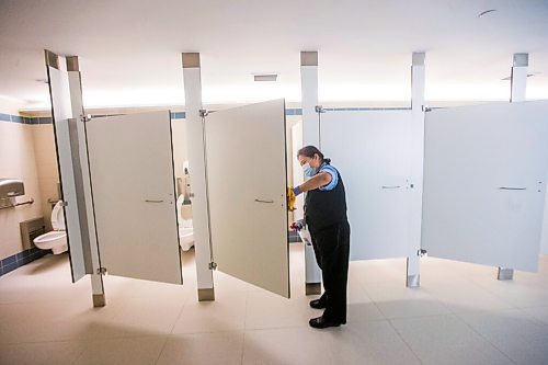 MIKAELA MACKENZIE / WINNIPEG FREE PRESS

Cynthia Cleodora wipes down high-touch areas in the washroom at the Winnipeg James Armstrong Richardson International Airport in Winnipeg on Wednesday, July 8, 2020. For Ben Waldman story.
Winnipeg Free Press 2020.