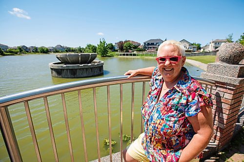 MIKE DEAL / WINNIPEG FREE PRESS
Susan Ash who lives in Royalwood close to the Fountain View Park which has a large bowl like fountain which is a centre piece to the pond to keep algae at by by aerating the water. With the fountain off there has been a noticeable increase in algae that has kept many people from taking their small watercraft onto the water.
Ash, and some other residents, want the city to restart aeration fountains that were shut off due to a budget cut. She said the algae smells terrible, puts off a bad odour and raises concerns about property values. 
200708 - Wednesday, July 08, 2020.