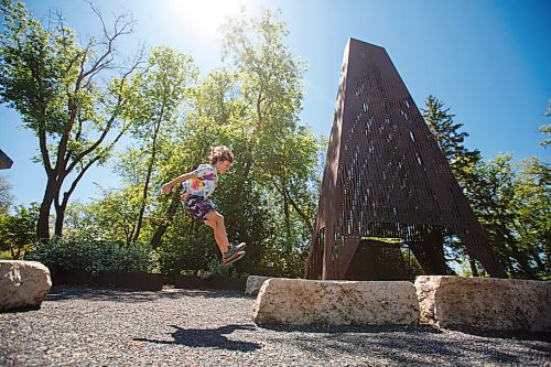 MIKE DEAL / WINNIPEG FREE PRESS
The Ecobuage sculpture, beside the duck pond at St. Vital Park doubles as a chimney for a fire pit.
Leif Timmerman, 8, who belongs to a parkour gym, uses the limestones benches around the art installation to practice.
See Brenda Suderman Sunday special 
200708 - Wednesday, July 08, 2020.