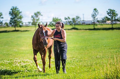 MIKAELA MACKENZIE / WINNIPEG FREE PRESS

Jennifer Tourangeau poses for a portrait with double stakes winner Deep Explorer at the Assiniboia Downs in Winnipeg on Friday, July 10, 2020. For George Williams story.
Winnipeg Free Press 2020.