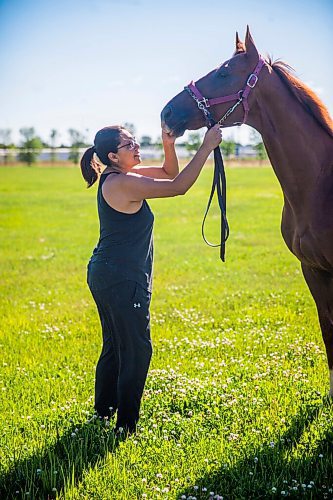 MIKAELA MACKENZIE / WINNIPEG FREE PRESS

Jennifer Tourangeau poses for a portrait with double stakes winner Deep Explorer at the Assiniboia Downs in Winnipeg on Friday, July 10, 2020. For George Williams story.
Winnipeg Free Press 2020.