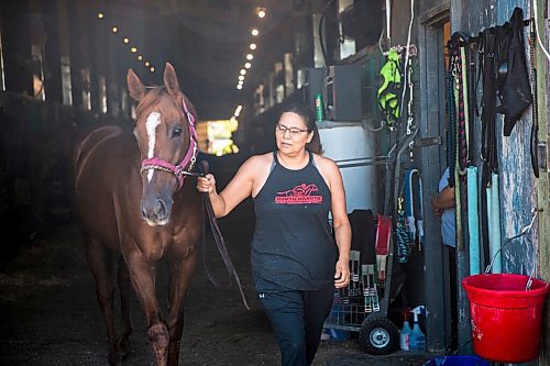 MIKAELA MACKENZIE / WINNIPEG FREE PRESS

Jennifer Tourangeau poses for a portrait with double stakes winner Deep Explorer at the Assiniboia Downs in Winnipeg on Friday, July 10, 2020. For George Williams story.
Winnipeg Free Press 2020.