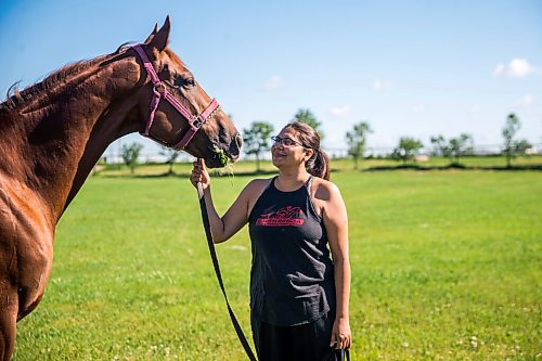 MIKAELA MACKENZIE / WINNIPEG FREE PRESS

Jennifer Tourangeau poses for a portrait with double stakes winner Deep Explorer at the Assiniboia Downs in Winnipeg on Friday, July 10, 2020. For George Williams story.
Winnipeg Free Press 2020.