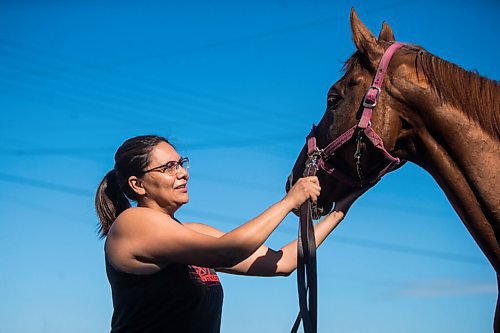 MIKAELA MACKENZIE / WINNIPEG FREE PRESS

Jennifer Tourangeau poses for a portrait with double stakes winner Deep Explorer at the Assiniboia Downs in Winnipeg on Friday, July 10, 2020. For George Williams story.
Winnipeg Free Press 2020.