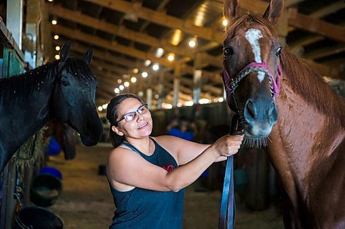 MIKAELA MACKENZIE / WINNIPEG FREE PRESS

Jennifer Tourangeau poses for a portrait with double stakes winner Deep Explorer at the Assiniboia Downs in Winnipeg on Friday, July 10, 2020. For George Williams story.
Winnipeg Free Press 2020.