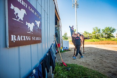 MIKAELA MACKENZIE / WINNIPEG FREE PRESS

Jennifer Tourangeau poses for a portrait with double stakes winner Deep Explorer at the Assiniboia Downs in Winnipeg on Friday, July 10, 2020. For George Williams story.
Winnipeg Free Press 2020.