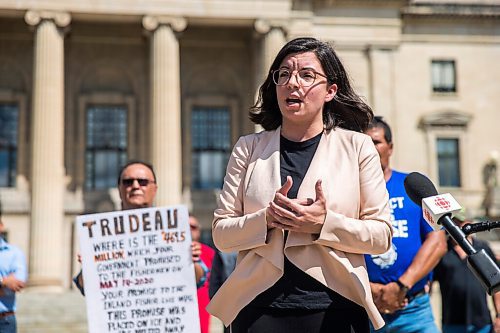 MIKAELA MACKENZIE / WINNIPEG FREE PRESS

Niki Ashton, NDP member of parliament for Churchill-Keewatinook Aski, speaks to the media about the lack of support from the federal government for Manitobas commercial fishers with commercial fishers and community representatives standing behind at the Manitoba Legislative Building in Winnipeg on Friday, July 10, 2020. For Dillon/Gabrielle? story.
Winnipeg Free Press 2020.