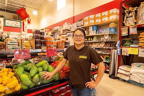 Mike Sudoma / Winnipeg Free Press
Linda Eng, the store manager of Youngs Market on William stands by the mangoes stand in the stores produce section. A very popular spot in the summer months
July 10, 2020