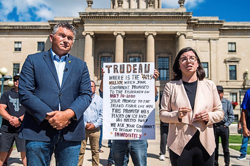 MIKAELA MACKENZIE / WINNIPEG FREE PRESS

James Bezan, Conservative member of parliament for Selkirk-Interlake-Eastman (left) and Niki Ashton, NDP member of parliament for Churchill-Keewatinook Aski, speak to the media about the lack of support from the federal government for Manitobas commercial fishers with commercial fishers and community representatives standing behind at the Manitoba Legislative Building in Winnipeg on Friday, July 10, 2020. For Dillon/Gabrielle? story.
Winnipeg Free Press 2020.