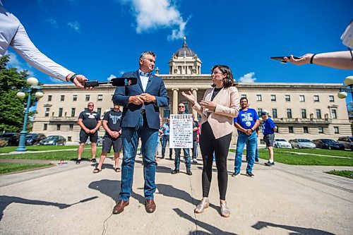 MIKAELA MACKENZIE / WINNIPEG FREE PRESS

James Bezan, Conservative member of parliament for Selkirk-Interlake-Eastman (left) and Niki Ashton, NDP member of parliament for Churchill-Keewatinook Aski, speak to the media about the lack of support from the federal government for Manitobas commercial fishers with commercial fishers and community representatives standing behind at the Manitoba Legislative Building in Winnipeg on Friday, July 10, 2020. For Dillon/Gabrielle? story.
Winnipeg Free Press 2020.