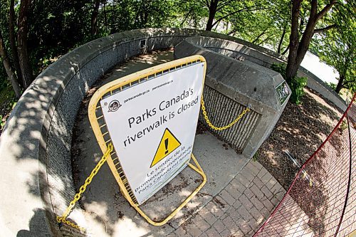 Mike Sudoma / Winnipeg Free Press
Signage showcasing the closure of the river walk at the Forks due to high water conditions
July 10, 2020