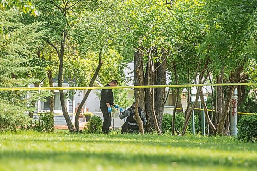 Mike Sudoma / Winnipeg Free Press
Winnipeg Police Services Tactical Team places an unknown item into a clear plastic bag in Montrose park Saturday afternoon 
July 11, 2020