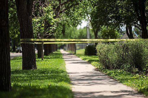 Mike Sudoma / Winnipeg Free Press
Yellow caution tape hangs from the trees as Winnipeg Police Services Tactical Unity check on a mysterious package in Montrose park Saturday afternoon 
July 11, 2020