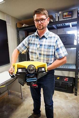 MIKE DEAL / WINNIPEG FREE PRESS
Manuel Maendel holds the VideoRay Mission Specialist Pro 5 ROV (remotely operated vehicle) that they use during search missions.
Paul and Manuel Maendel started the Hutterian Emergency Aquatic Response Team (HEART) a volunteer dive team specializing in search, rescue and recovery of missing people. Based out of the Oak Bluff Hutterite Colony in southern Manitoba they recently teamed up with the RCMP to help recover Nour Ali's body after his boat capsized on Lake Winnipeg.
See Melissa Martin special feature
200709 - Thursday, July 09, 2020.