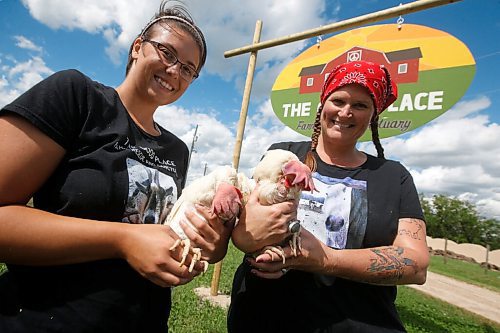 JOHN WOODS / WINNIPEG FREE PRESS
Janine Watts, right, and Kristi Wieffering, volunteers at The Good Place Farm Rescue & Sanctuary, spend time with Phoenix and Lola at the rescue farm just east of Winnipeg Tuesday, January 14, 2020. The two hens were found alive among a truckload of dead chicken carcasses at the landfill. The Good Place rescued the hens.

Reporter: Piche