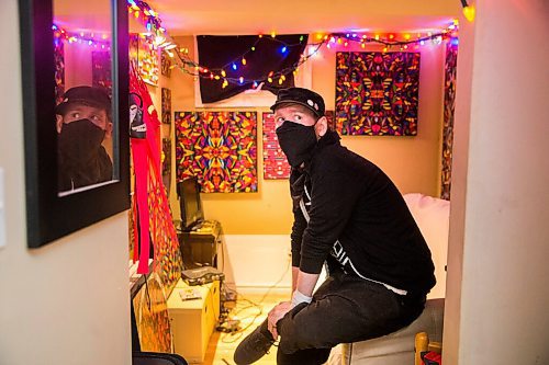 MIKAELA MACKENZIE / WINNIPEG FREE PRESS

JD Renaud poses for a portrait with some of the five things that are getting him through this pandemic (collages, office supply masks) in his home in Winnipeg on Wednesday, July 15, 2020. 
Winnipeg Free Press 2020.
