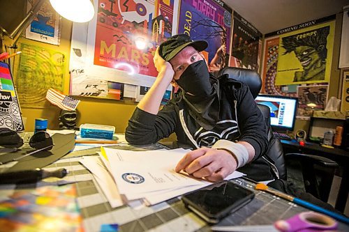 MIKAELA MACKENZIE / WINNIPEG FREE PRESS

JD Renaud poses for a portrait with some of the five things that are getting him through this pandemic (posters and canvases, random letters, and iPod touch) in his home in Winnipeg on Wednesday, July 15, 2020. 
Winnipeg Free Press 2020.