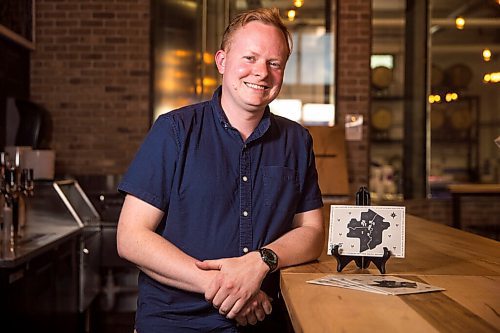 MIKAELA MACKENZIE / WINNIPEG FREE PRESS

Rob Stansel, who has started an online beer venture called Middle Tap, poses for a portrait with a map of local breweries at Barn Hammer Brewing Company in Winnipeg on Wednesday, July 15, 2020. For Ben Sigurdson story.
Winnipeg Free Press 2020.