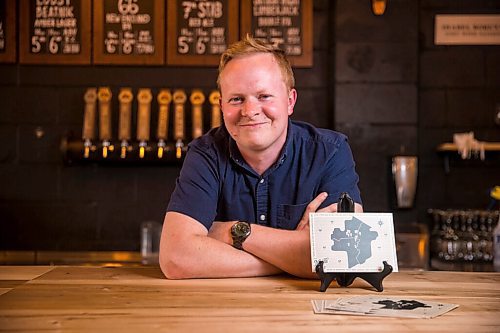 MIKAELA MACKENZIE / WINNIPEG FREE PRESS

Rob Stansel, who has started an online beer venture called Middle Tap, poses for a portrait with a map of local breweries at Barn Hammer Brewing Company in Winnipeg on Wednesday, July 15, 2020. For Ben Sigurdson story.
Winnipeg Free Press 2020.