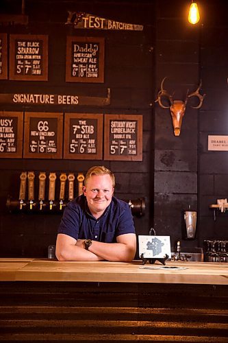 MIKAELA MACKENZIE / WINNIPEG FREE PRESS

Rob Stansel, who has started an online beer venture called Middle Tap, poses for a portrait with a map of local breweries at Barn Hammer Brewing Company in Winnipeg on Wednesday, July 15, 2020. For Ben Sigurdson story.
Winnipeg Free Press 2020.