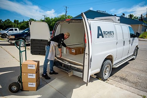JESSE BOILY  / WINNIPEG FREE PRESS
Jesse Thiessen loads frozen pizzas on to the delivery van at Archies Meats and Groceries in Starbuck on Thursday. Thursday, July 16, 2020.
Reporter: Dave
