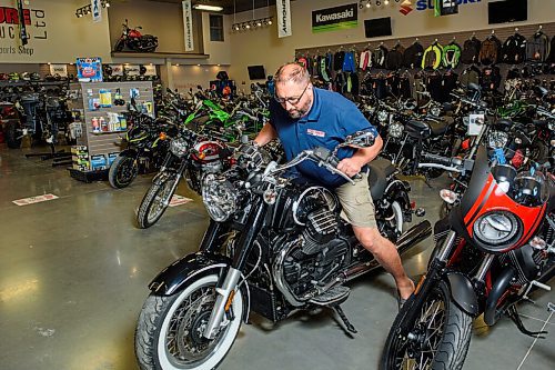 JESSE BOILY  / WINNIPEG FREE PRESS
Derek Roth, owner of Adventure Power Products, moves one of the motorcycles at his store in Ile de Chenes on Thursday. Roth has seen an increase in motorcycle sales at his store during the pandemic. Thursday, July 16, 2020.
Reporter: Kellen