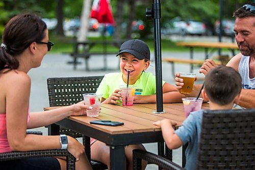 MIKAELA MACKENZIE / WINNIPEG FREE PRESS

Avary Lewis, nine, laughs with her family (left to right Stefanie Amyot, Duke Lewis, and Dave Lewis) at the Cargo Bar in Assiniboine Park in Winnipeg on Friday, July 17, 2020. For Jen Zoratti Take 5 story.
Winnipeg Free Press 2020.
