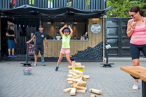 MIKAELA MACKENZIE / WINNIPEG FREE PRESS

Avary Lewis, nine, reacts as the jenga tower falls over after her mom, Stefanie Amyot, pulled a block out at the Cargo Bar in Assiniboine Park in Winnipeg on Friday, July 17, 2020. For Jen Zoratti Take 5 story.
Winnipeg Free Press 2020.