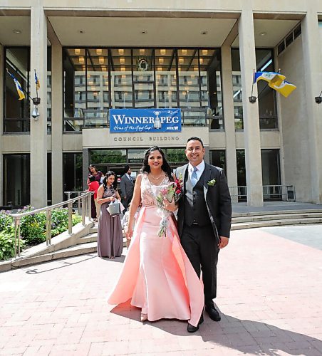 RUTH BONNEVILLE / WINNIPEG FREE PRESS

LOCAL - 1st city hall wedding since COVID 

Ankita  and her groom, Harman Mavi share their vows, first kiss and wedding day with close family at City Hall on Friday. 

Story: Ankita and Harman (groom) Mavi are the first couple to have their wedding at City Hall since the start of COVID. Reporter talking to the first couple to get married at City Hall since that option closed during the pandemic. 

The short ceremony with close family began at  12 p.m on the Mayors foyer (second floor of city council building) on Friday. 

Gabrielle Piché story.

July 17th, 2020