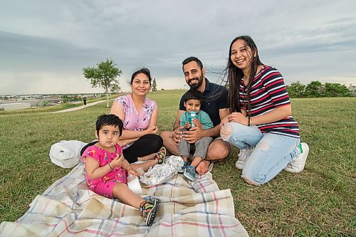 Mike Sudoma / Winnipeg Free Press
(left to right) Japrose, Aarti, Rahul, and Gorsanjh Dhingra celebrate Nihistas (far right) birthday atop Garbage Hill Friday afternoon
July 17, 2020